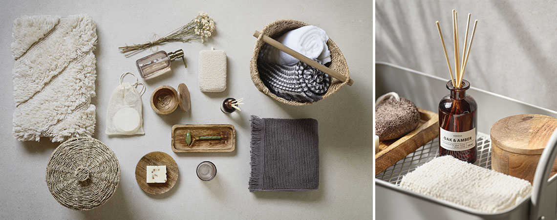 Asciugamani di cotone, oli profumati e altri accessori da bagno posizionati su uno sfondo beige