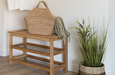 TOMMERUP bench and GODSKE artificial plant. Wardrobe area with shoe storage, plant and bag.