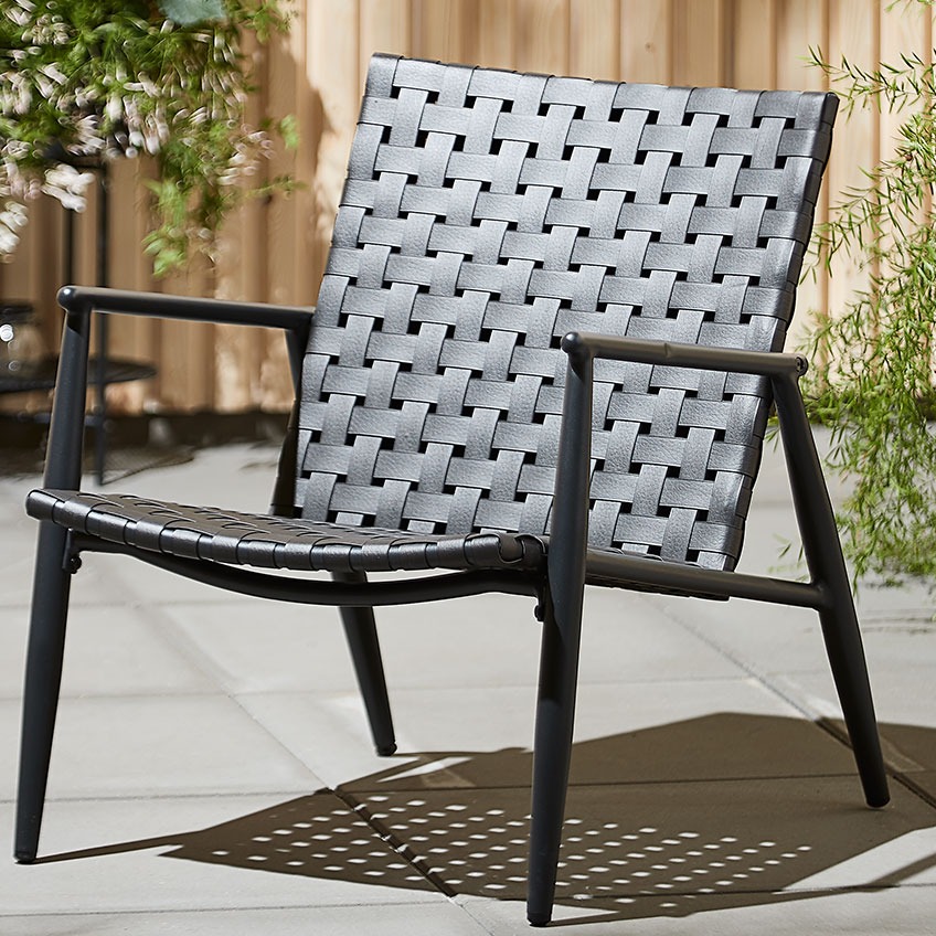 Black garden lounge chair on a patio