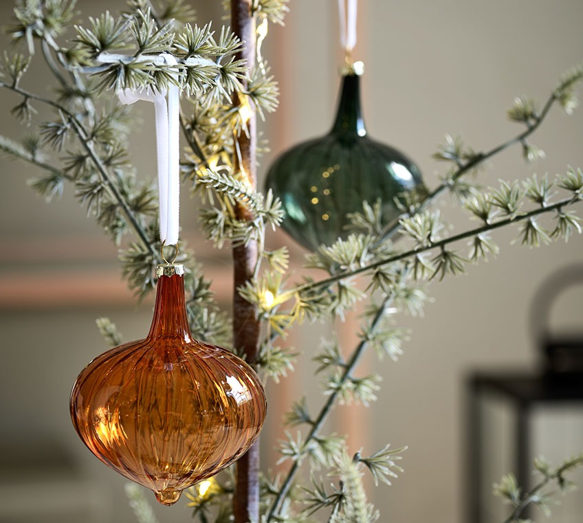 Yellow and green SKADI baubles in recycled glass and MODI artificial Christmas tree Glass baubles on a slim Christmas tree