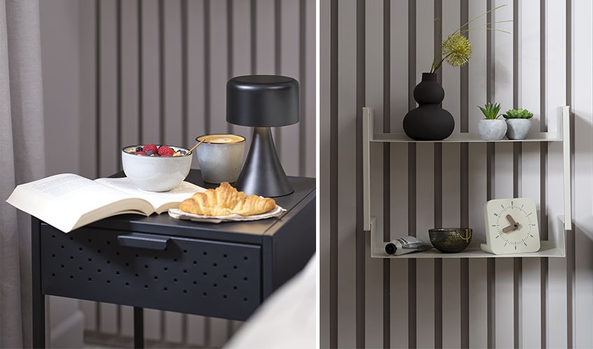 Comodino VIRUM, tazza LAUKE, mensola a muro ASSENS e orologio EDDIE, lampada JACOB Comodino nero con libro e colazione e mensola a muro in metallo e lampada nera