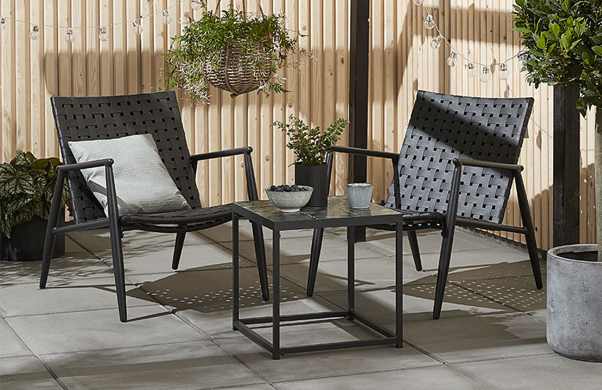 Black garden lounge set with small table and two chairs 