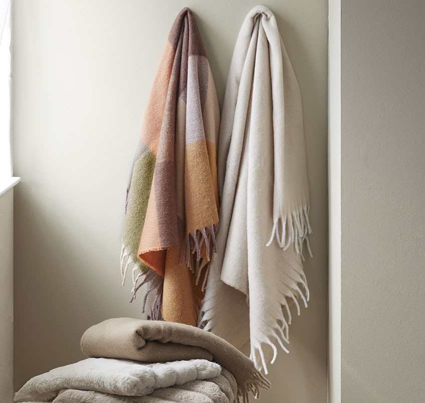 Multi-coloured and beige throws 